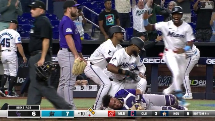 Marlins use defense pitching stifle giants